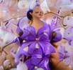 Religious image dressed in purple and decorated with flowers