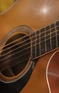 Acoustic guitar soundhole and strings